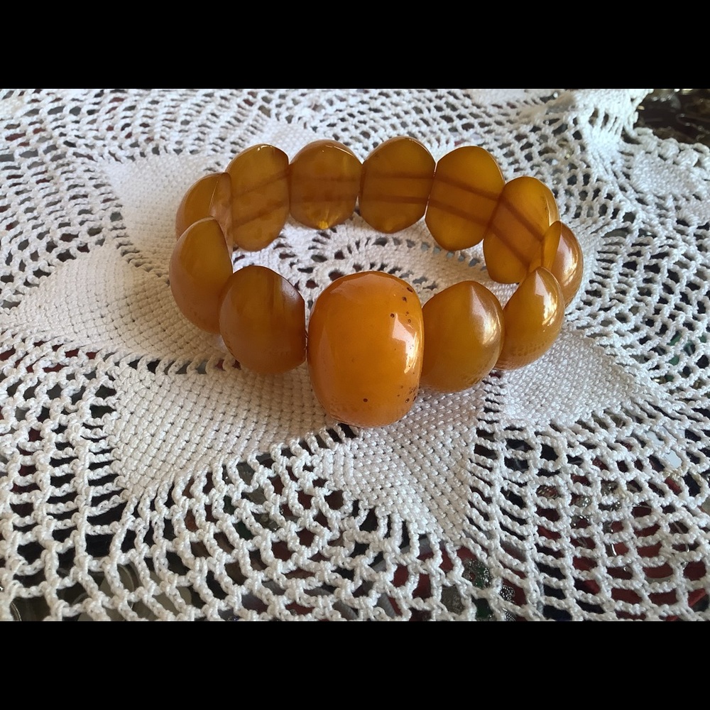 Orange handcrafted stretch bracelet .